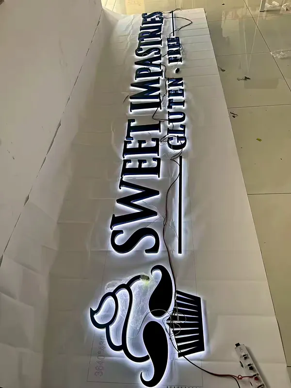 Halo-lit letters for Sweet Impastries lit and tested before install